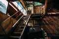 Iron rusty staircase in the brick shop of the abandoned factory, inside the interior