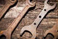 Iron rusty tools wrench on an old wooden table Royalty Free Stock Photo