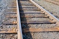 Iron Rusty Train Railway Detail Over Dark Stones Royalty Free Stock Photo