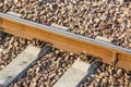 Iron rusty train railway detail over dark stones rail way Royalty Free Stock Photo