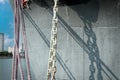 Iron rusty white  chain on military navy  ship at anchor Royalty Free Stock Photo