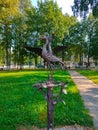 Iron sculpture of two storks in the park