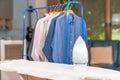 Iron and shirt on ironing board Royalty Free Stock Photo