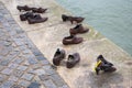 Iron shoes memorial to Jewish people executed WW2 in Budapest Hungary. Shoes on the Danube bank River Royalty Free Stock Photo