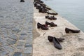 Iron shoes memorial to Jewish people executed WW2 in Budapest Hungary. Shoes on the Danube bank River Royalty Free Stock Photo