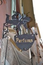 The iron signboard in vide cupids with inscription Parfums