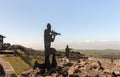 Iron  silhouettes of soldiers with a gun, standing in a trench and looking into the distance, on Mount Bental in the Golan Heights Royalty Free Stock Photo