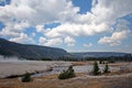 Iron Spring Creek flowing past Cliff Geyser in Black Sand Geyser Basin in Yellowstone National Park in Wyoming USA Royalty Free Stock Photo