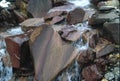 Stained stones eroded by river Royalty Free Stock Photo