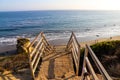 An iron staircase leading down the beach over looking the deep blue ocean and the beach at El Matador beach Royalty Free Stock Photo