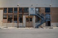 Iron stairs in front of vintage industrial facade of old factory building Royalty Free Stock Photo