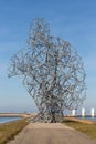 Iron statue of man on dam in Lelystad, The Netherlands