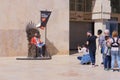 Iron Throne from series Game of Thrones on streets of Valleta, Malta and a crowd of fans who want to take pictures