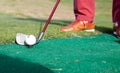 Iron to ball and takes aim at the golf course Royalty Free Stock Photo