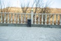 Iron trash can near the window Royalty Free Stock Photo