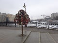 An iron tree with locks on the bridge.Bolotnaya Square, Moscow, Russia
