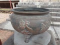 Iron vessel with Japanese writing used for burning incense. At the bottom stairs. Buddhist temple located in the city of Suzano