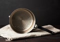 Iron vintage colander on a wooden table Royalty Free Stock Photo