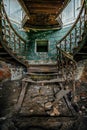 Iron vintage stairs with rivets in the old abandoned mansion Royalty Free Stock Photo