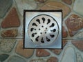 Iron water drain holes are commonly used in bathrooms, toilets and in other public places Royalty Free Stock Photo