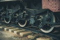 Iron wheels of steam engine locomotive train on railway track