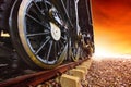 Iron wheels of stream engine locomotive train on railways track