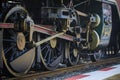 Iron wheels of stream engine locomotive train on railways track Royalty Free Stock Photo