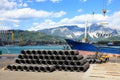 Iron wire in harbor with forklift and ship