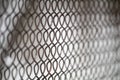 Iron wire mesh fence on white background. mesh netting galvanized. perspective going into the distance Royalty Free Stock Photo