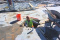 An Iron Worker Prepares a Bolt Pattern for a Steel Column