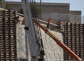 Iron workers on wall of rebar and steel beams on freeway construction project Royalty Free Stock Photo