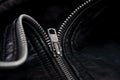 Iron zipper on a black leather jacket, needlework concept Royalty Free Stock Photo