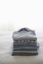 Ironed And Folded Shirts On Bed