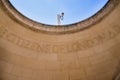 Ironic contrast of security camera and stone carving