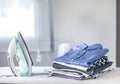 Ironing clothes on ironing board Royalty Free Stock Photo