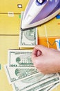 Ironing dollars banknote Royalty Free Stock Photo