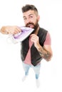 Ironing out. Bearded man smoothing beard hair with iron. Providing household services. Hipster with electric ironing Royalty Free Stock Photo