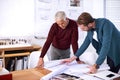 Ironing out the problems. two male architects working together in their office. Royalty Free Stock Photo