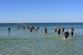 Ironman competitors exit ocean in Panama City Beach, Florida.