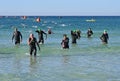 Ironman competitors exit ocean in Panama City Beach, Florida.