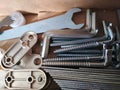 Ironmongery silver bronze iron stainless steel wrench tapping repair cardboard background macro photo