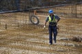 Ironworker worker carrying iron bars