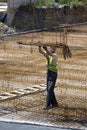 Ironworker worker holding iron bars