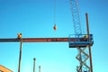 Ironworkers Fit-Up an I-Beam Suspended from Crane Royalty Free Stock Photo