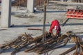 Ironworkers unload and position reinforcing steel Royalty Free Stock Photo