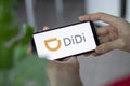 IRPEN, UKRAINE - JANUARY 20 20223, Closeup of smartphone screen Didi logo lettering with in man's hands