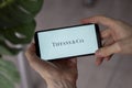 IRPEN, UKRAINE - JANUARY 20 20223, Closeup of smartphone screen Tiffany logo lettering with in man's hands