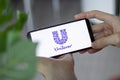 IRPEN, UKRAINE - JANUARY 20 20223, Closeup of smartphone screen Unilever logo lettering with in man's hands