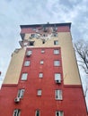 Irpen, Ukraine. May 07. 2022. The end of an apartment building with a damaged wall and broken windows from the shot