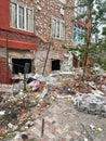 Irpen, Ukraine. May 07. 2022. Mountains of construction debris on the sidewalk under the house where the projectile hit